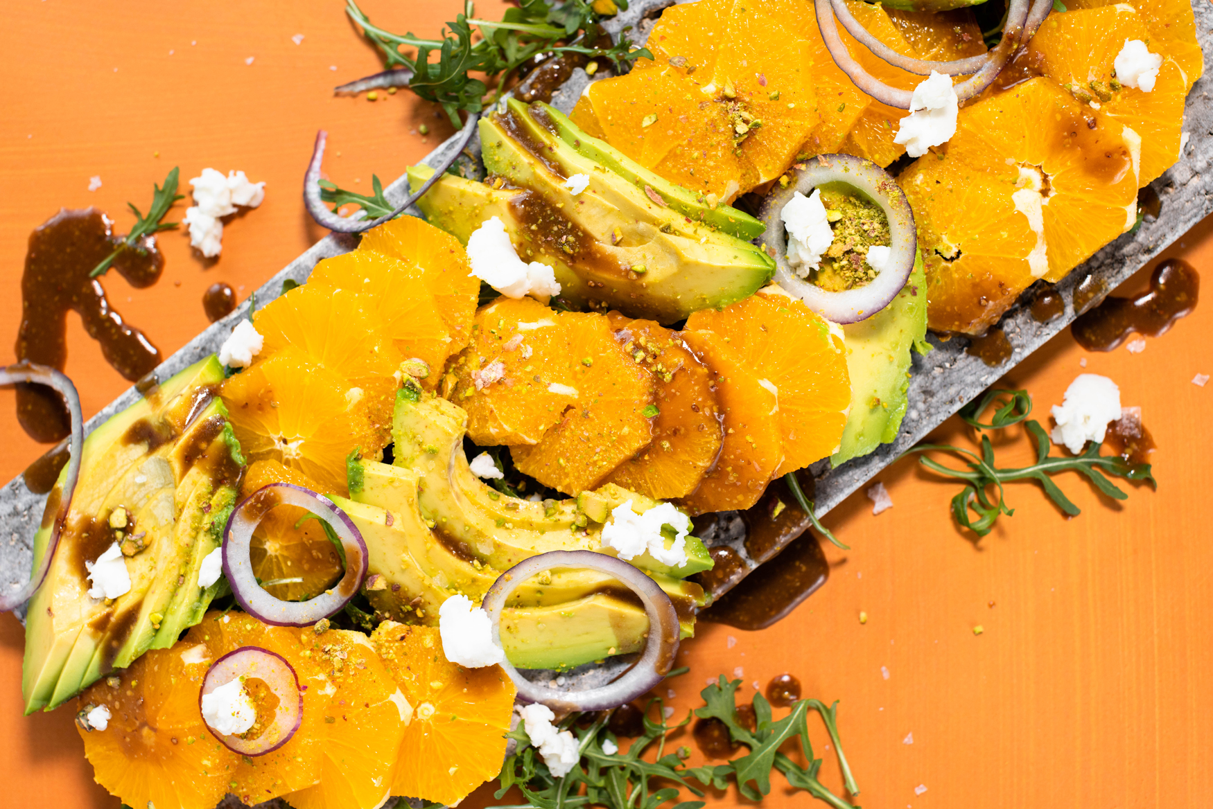 Navel avocado salad with arugula, red onion and goat cheese.